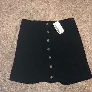 Black button mini skirt